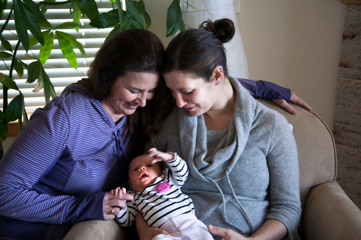 new mother with her baby and her mother