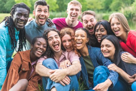 group-of-smiling-people-spending-time-together group of smiling people in a field