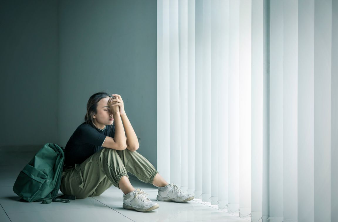 signs of self harm for teens (1) sad teenager facing window