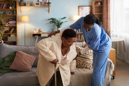 SCS Blog 3 elderly-black-woman-receiving-assistance-from-fema-2025-12-07-16-15-47-utc Caregiver helping woman