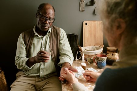 SCS Blog 3 senior-black-man-receiving-medication-from-senior-2025-07-08-21-37-00-utc Senior Receiving Medication