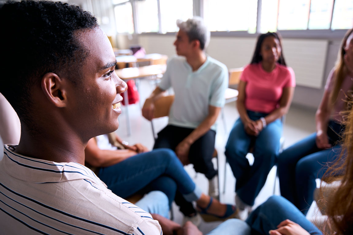 group of diverse people in group therapy